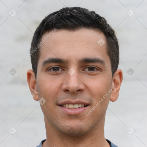 Joyful white young-adult male with short  black hair and brown eyes