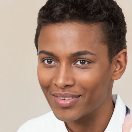 Joyful black young-adult male with short  brown hair and brown eyes