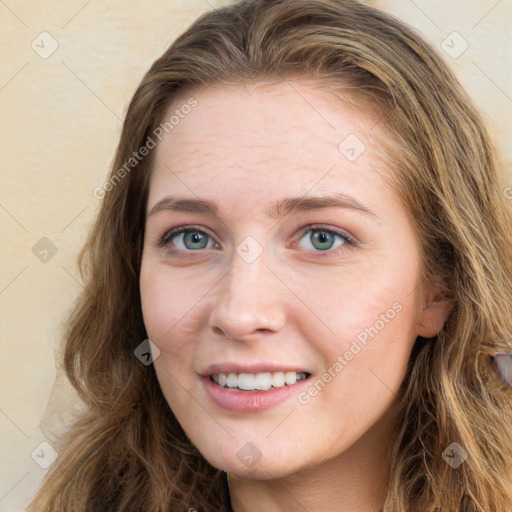 Joyful white young-adult female with long  brown hair and green eyes