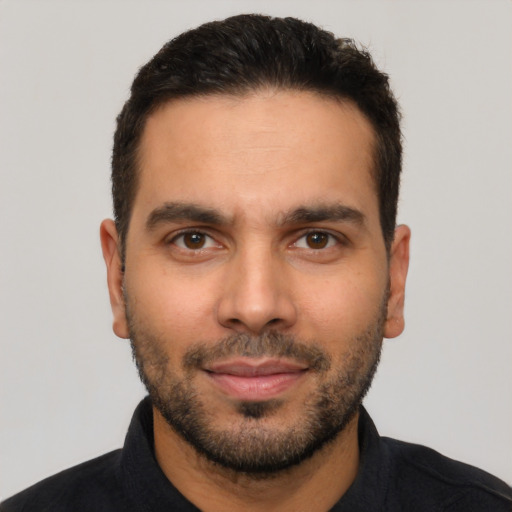 Neutral latino young-adult male with short  black hair and brown eyes