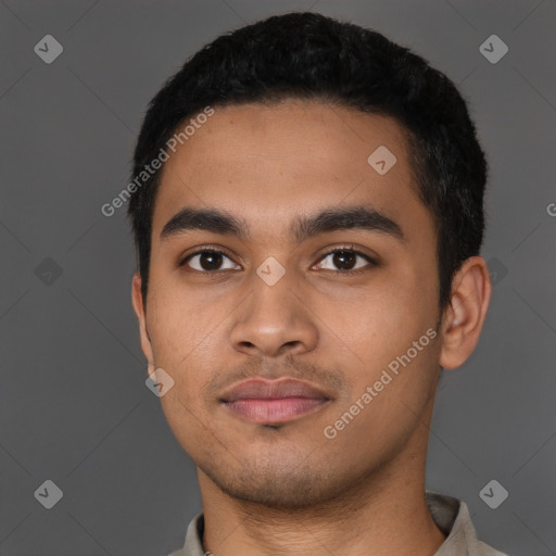 Neutral latino young-adult male with short  black hair and brown eyes