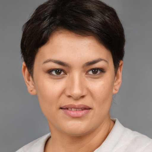 Joyful white young-adult female with short  brown hair and brown eyes