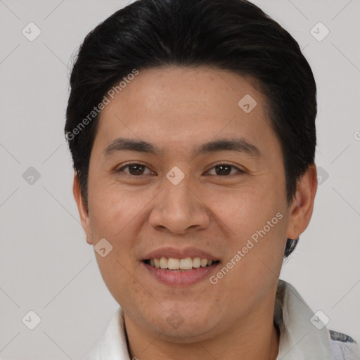 Joyful asian young-adult male with short  brown hair and brown eyes