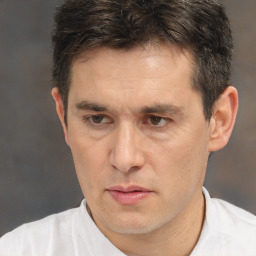 Neutral white adult male with short  brown hair and brown eyes