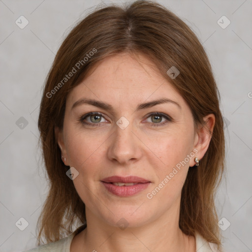 Joyful white adult female with medium  brown hair and grey eyes