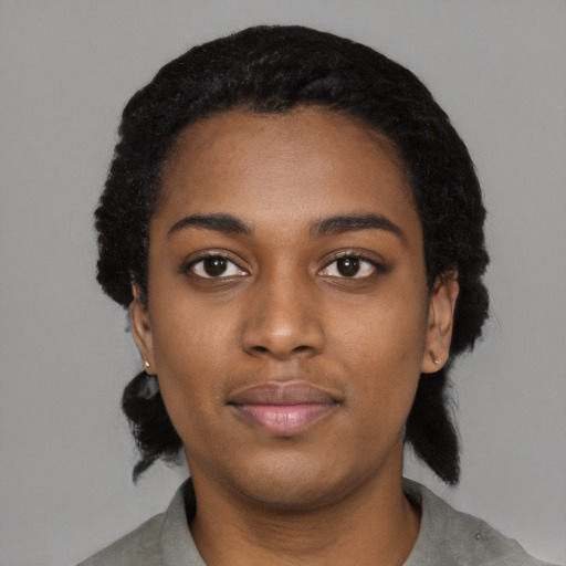 Neutral black young-adult female with medium  black hair and brown eyes