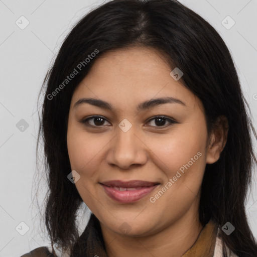 Joyful latino young-adult female with long  brown hair and brown eyes