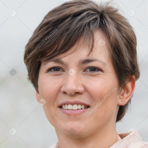 Joyful white adult female with short  brown hair and brown eyes