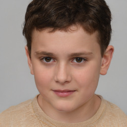 Joyful white child male with short  brown hair and brown eyes