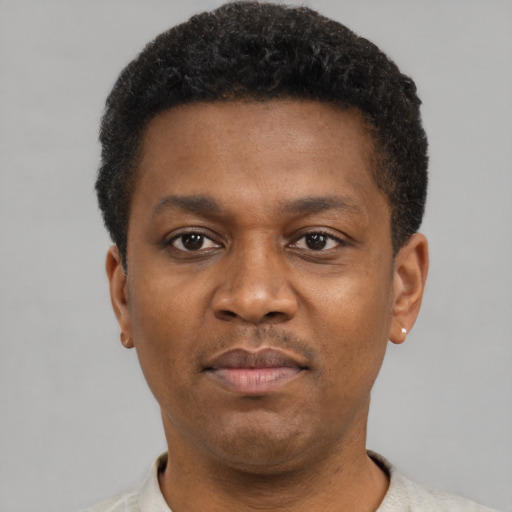 Neutral latino young-adult male with short  brown hair and brown eyes