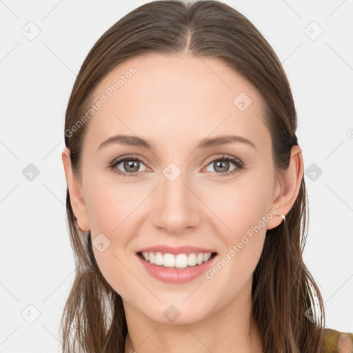 Joyful white young-adult female with long  brown hair and blue eyes