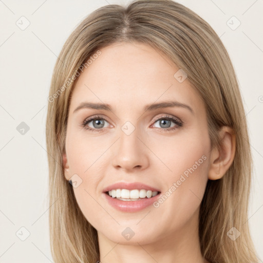 Joyful white young-adult female with long  brown hair and green eyes