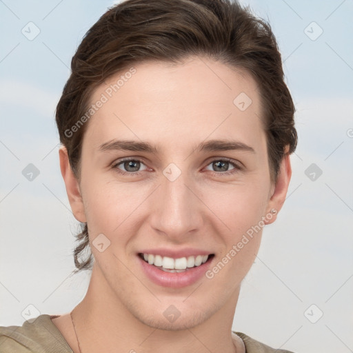 Joyful white young-adult female with short  brown hair and grey eyes