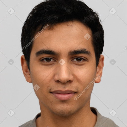 Joyful latino young-adult male with short  black hair and brown eyes