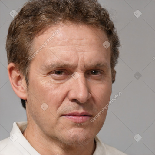 Joyful white middle-aged male with short  brown hair and brown eyes