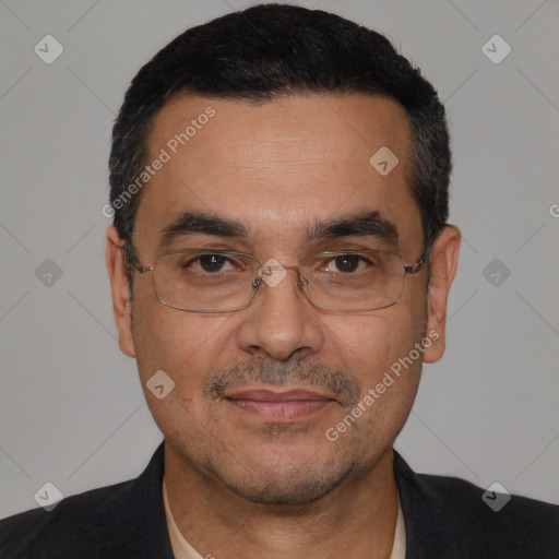 Joyful white adult male with short  black hair and brown eyes