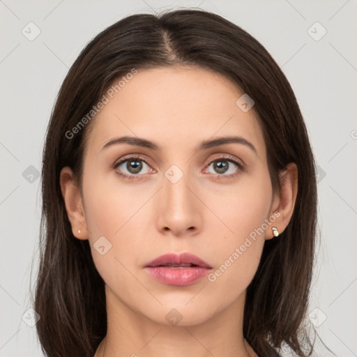 Neutral white young-adult female with long  brown hair and brown eyes