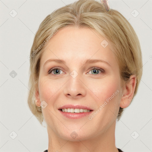 Joyful white young-adult female with medium  brown hair and blue eyes