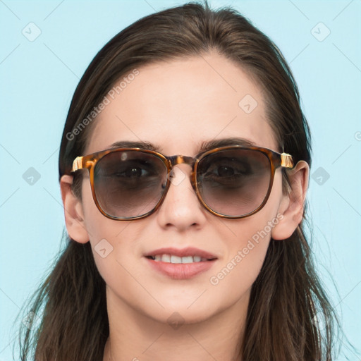 Joyful white young-adult female with long  brown hair and blue eyes