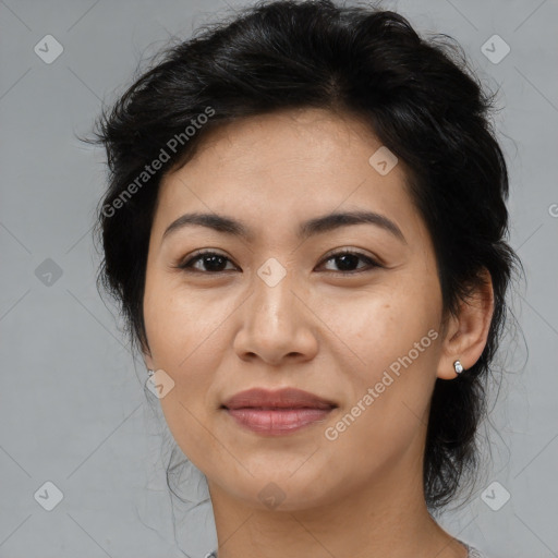 Joyful asian adult female with medium  brown hair and brown eyes