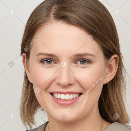 Joyful white young-adult female with medium  brown hair and grey eyes