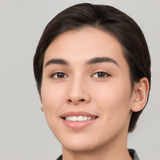 Joyful white young-adult female with medium  brown hair and brown eyes