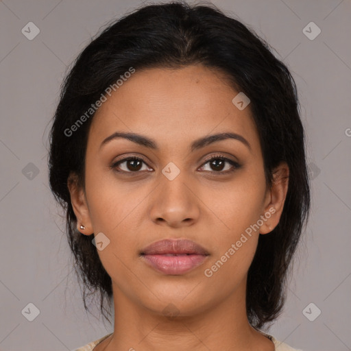 Joyful latino young-adult female with medium  brown hair and brown eyes