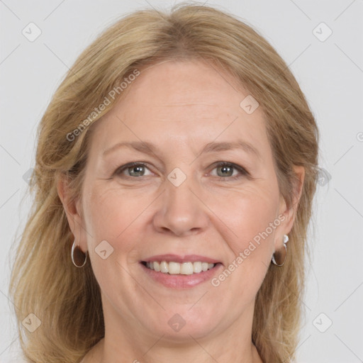 Joyful white adult female with medium  brown hair and grey eyes