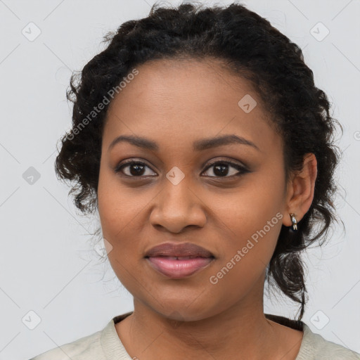 Joyful black young-adult female with medium  black hair and brown eyes