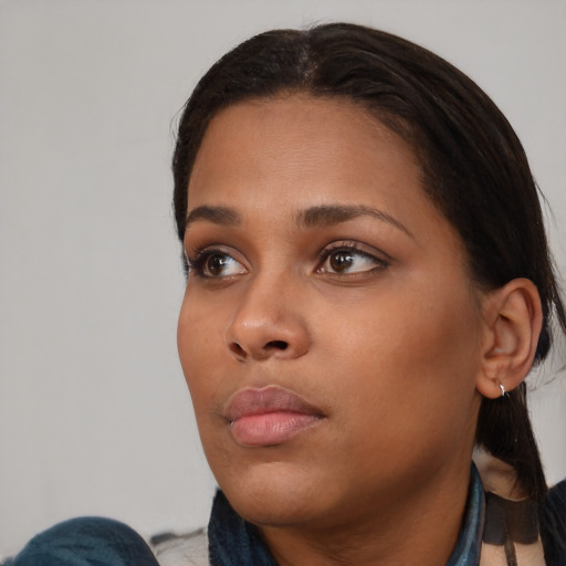 Neutral black young-adult female with medium  black hair and brown eyes