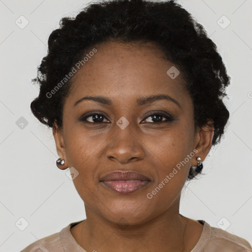 Joyful black adult female with short  brown hair and brown eyes