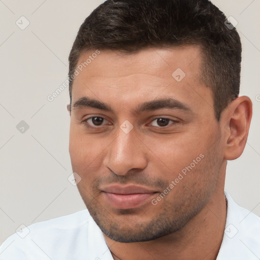 Joyful white young-adult male with short  brown hair and brown eyes