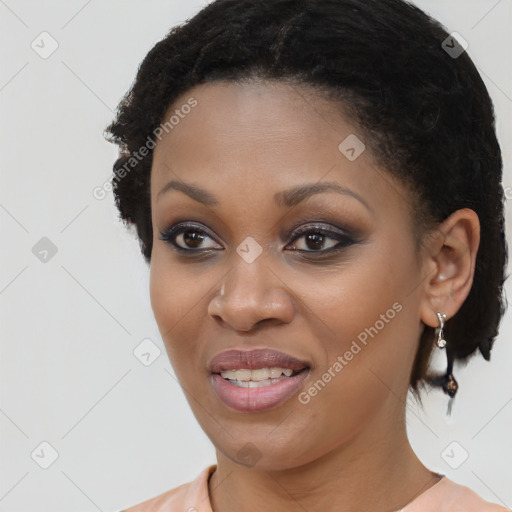 Joyful black young-adult female with short  brown hair and brown eyes