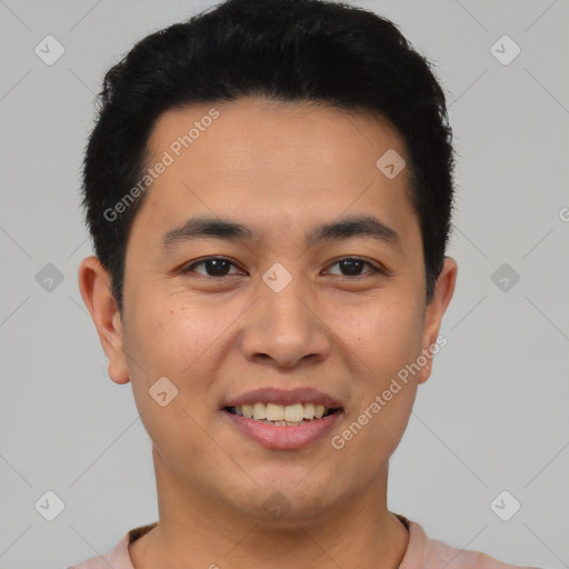 Joyful latino young-adult male with short  black hair and brown eyes