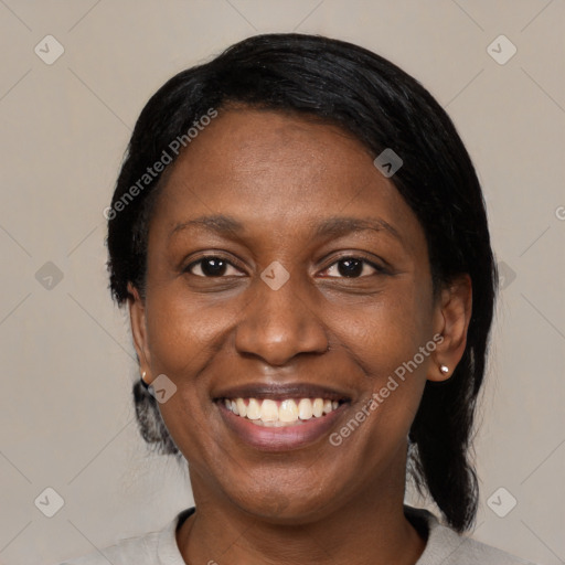 Joyful black young-adult female with medium  black hair and brown eyes