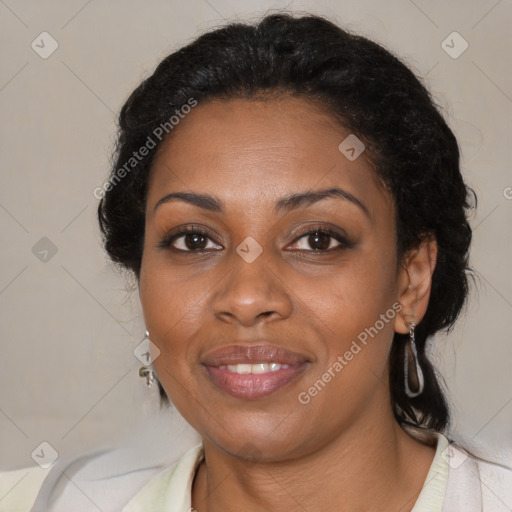 Joyful black adult female with medium  brown hair and brown eyes