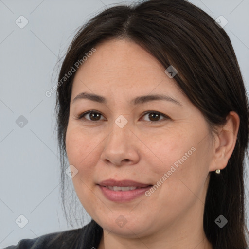 Joyful white adult female with medium  brown hair and brown eyes