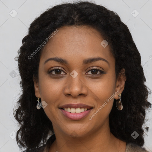 Joyful black young-adult female with long  brown hair and brown eyes