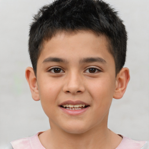 Joyful white child male with short  brown hair and brown eyes