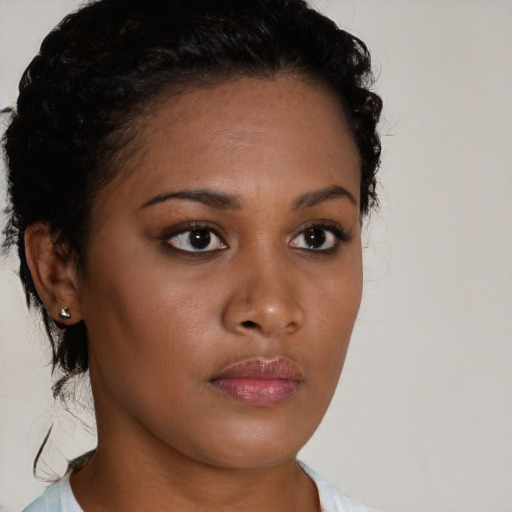 Neutral black young-adult female with short  brown hair and brown eyes