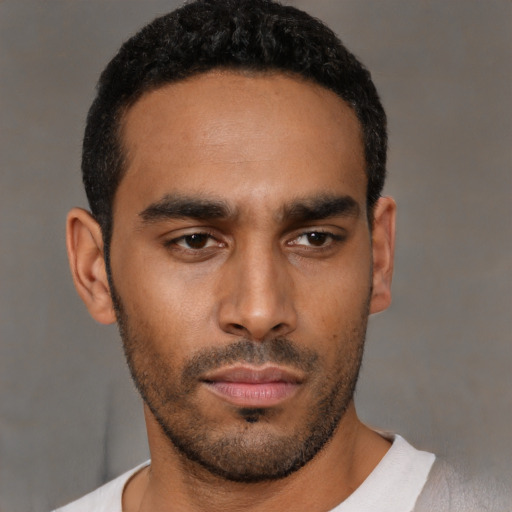 Neutral latino young-adult male with short  black hair and brown eyes