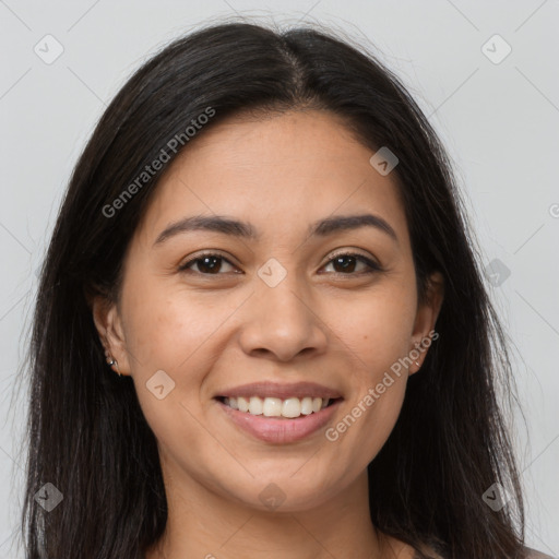 Joyful latino young-adult female with long  brown hair and brown eyes