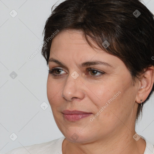 Joyful white adult female with medium  brown hair and brown eyes