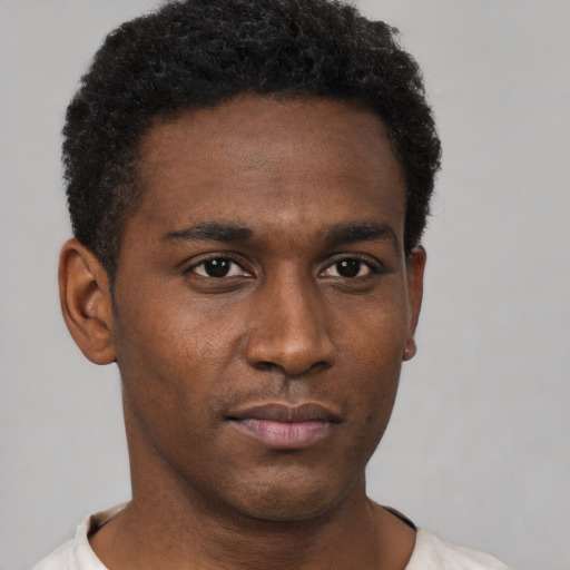 Neutral black young-adult male with short  black hair and brown eyes