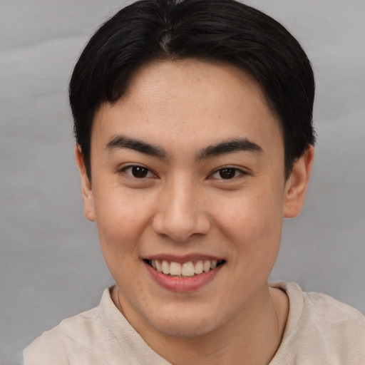 Joyful asian young-adult female with short  brown hair and brown eyes