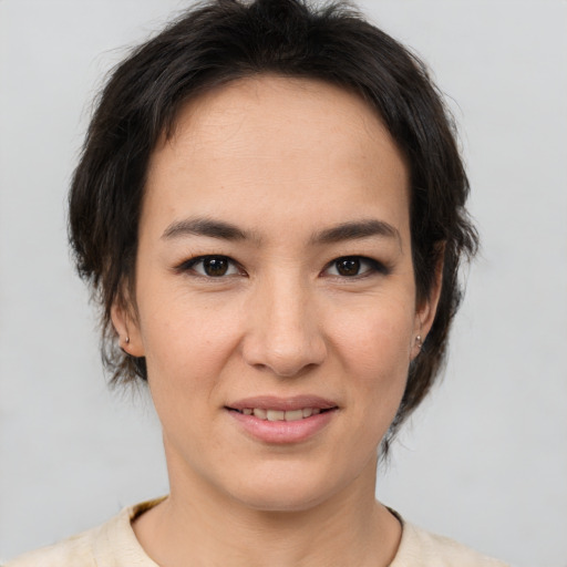 Joyful white young-adult female with medium  brown hair and brown eyes