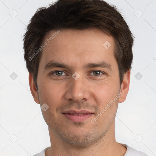 Joyful white adult male with short  brown hair and brown eyes