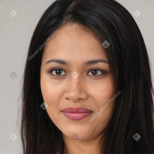 Joyful latino young-adult female with long  brown hair and brown eyes