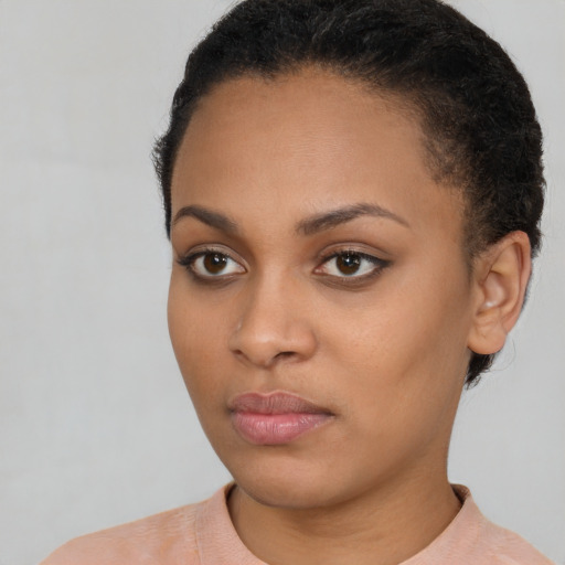 Neutral black young-adult female with short  brown hair and brown eyes