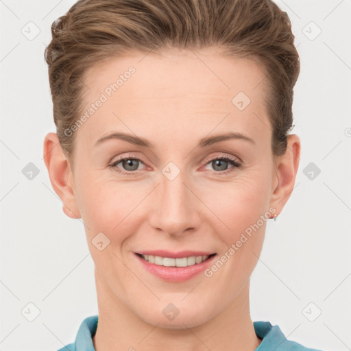 Joyful white young-adult female with short  brown hair and grey eyes